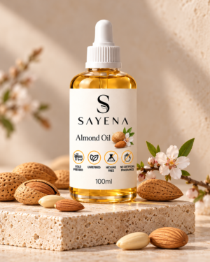 SAYENA Almond Oil 100ml bottle with almonds on an ivory stone display