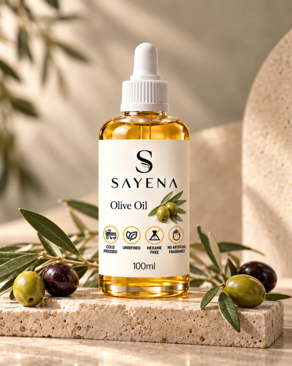 SAYENA Olive Oil 100ml bottle with olives on an ivory stone display